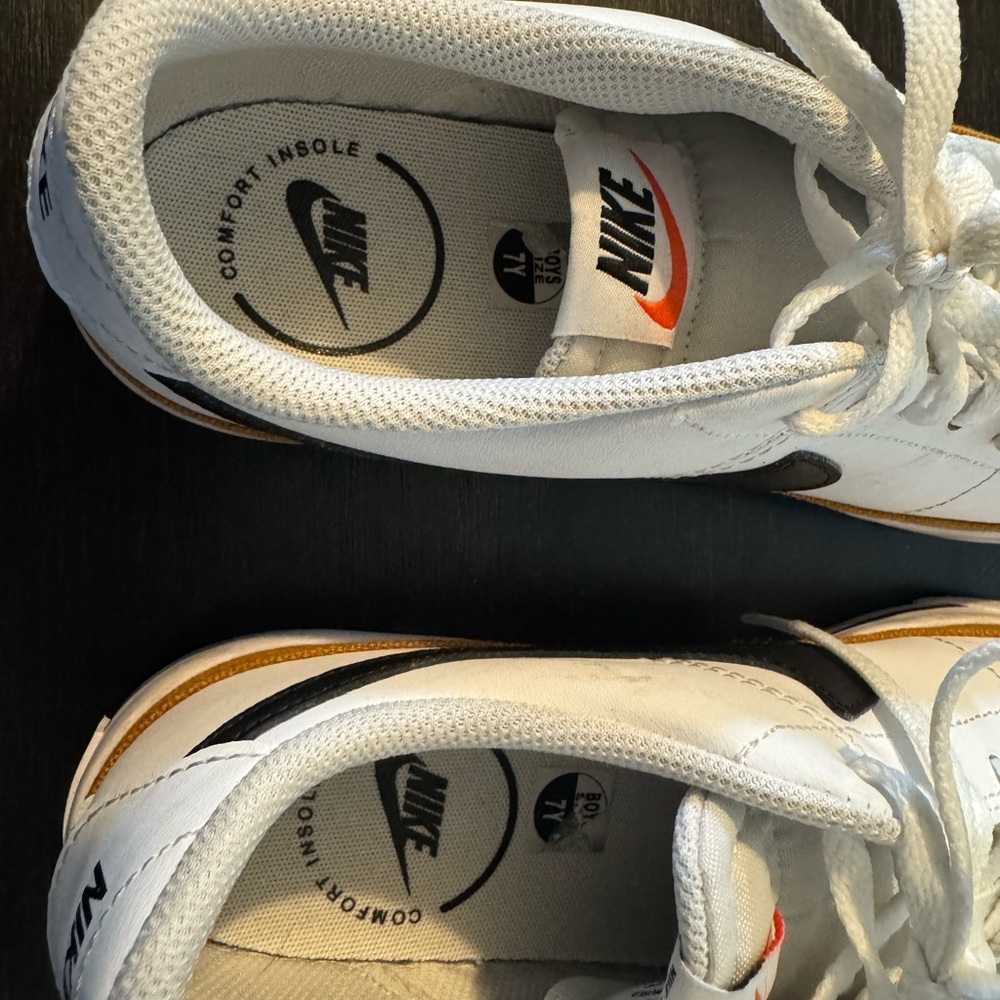 Nike White Low-Top Sneakers with Black Swoosh and Gold Accent - Picture 4 of 6